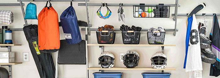 Adjustable garage shelving and racks holding sporting equipment in a garage in Jacksonville, FL