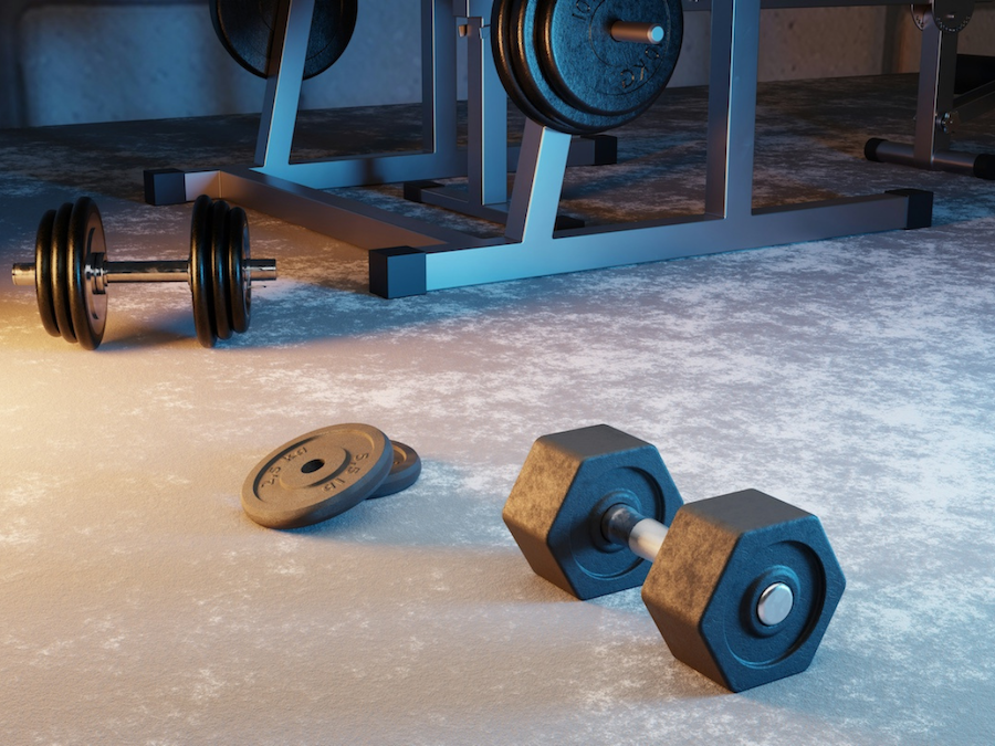 Garage transformed into a home gym with free weights and gym equipment on durable, sleek flooring.