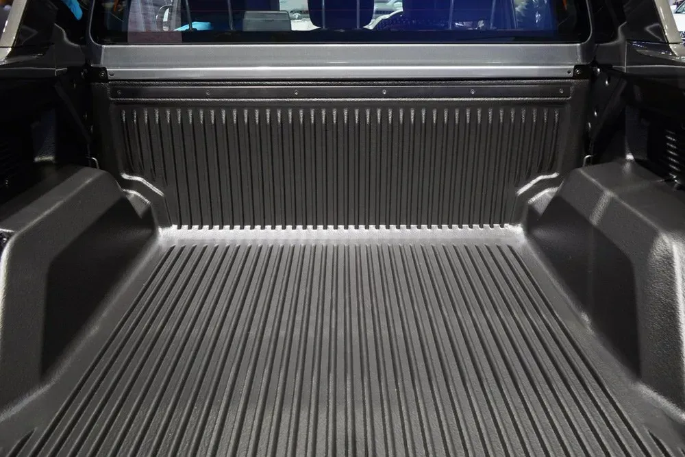 Black Truck Bed With Ribbed Floor and Walls — Rod's Engineering & Lifetime Trailers in Bli Bli, QLD