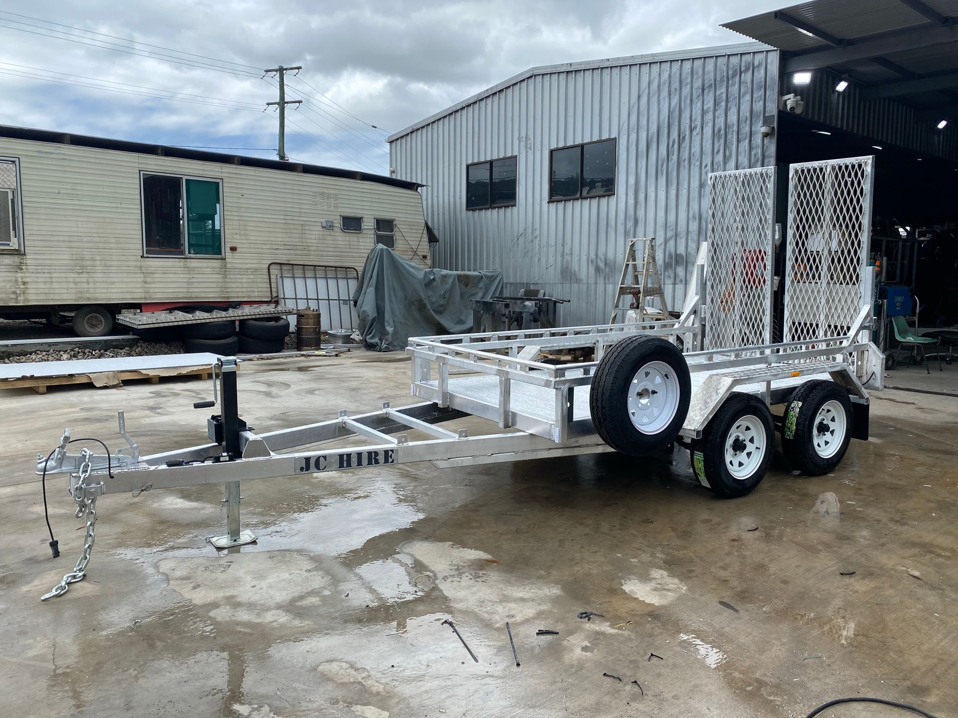 Silver Utility Trailer on a Grassy Area — Rod's Engineering & Lifetime Trailers in Bli Bli, QLD