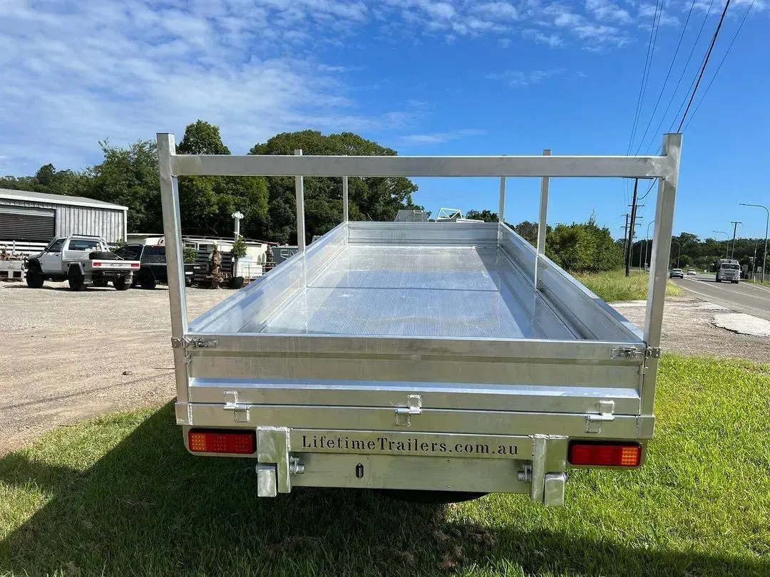 Back View of a Silver Flatbed Truck With Metal Frame — Rod's Engineering & Lifetime Trailers in Bli Bli, QLD