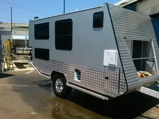 Silver Travel Trailer With Black Windows, Diamond Plate Trim — Rod's Engineering & Lifetime Trailers in Bli Bli, QLD