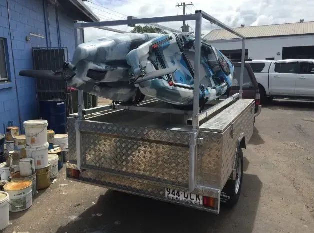 Silver Trailer Carrying Kayaks Secured to a Metal Frame — Rod's Engineering & Lifetime Trailers in Bli Bli, QLD