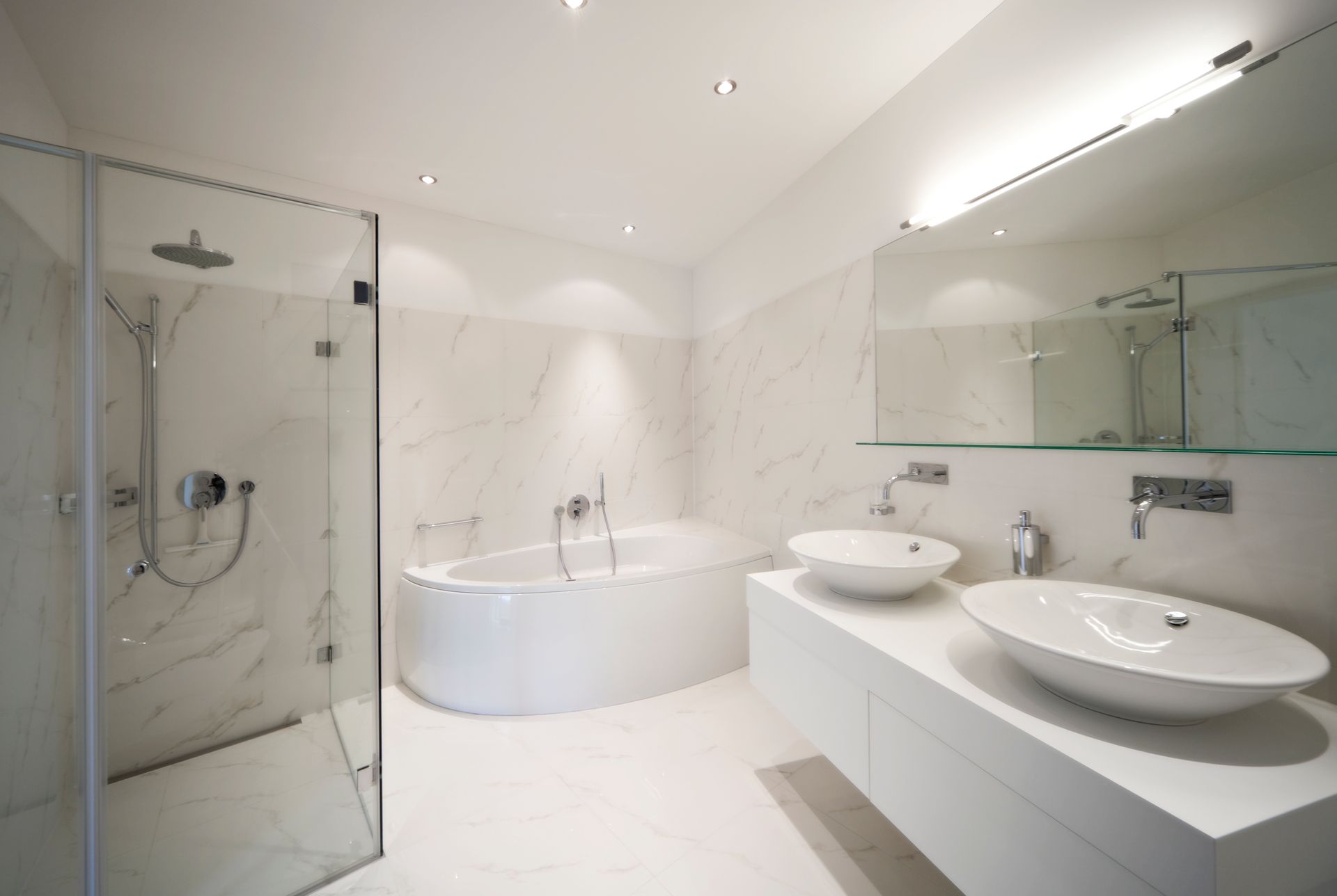 A modern bathroom featuring two sinks and a tub, showcasing elegant design and functionality. Shower