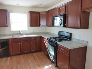 Professional Kitchen Remodeling — Reddish Brown And White Clean Kitchen in Lancaster, PA