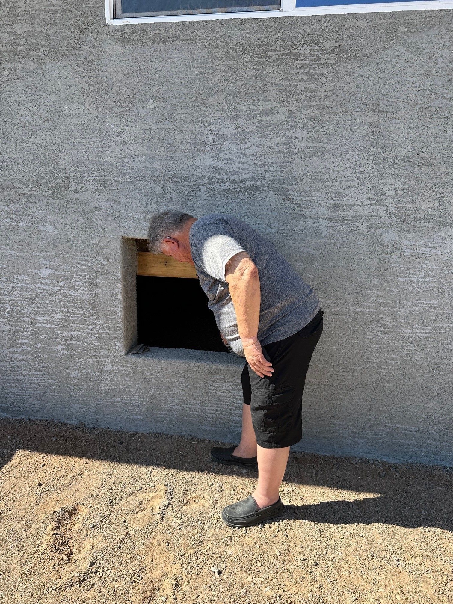 Man Checking the Hole on the Wall — Tucson, AZ — D Handyman LLC Rod Iron & Fencing Services