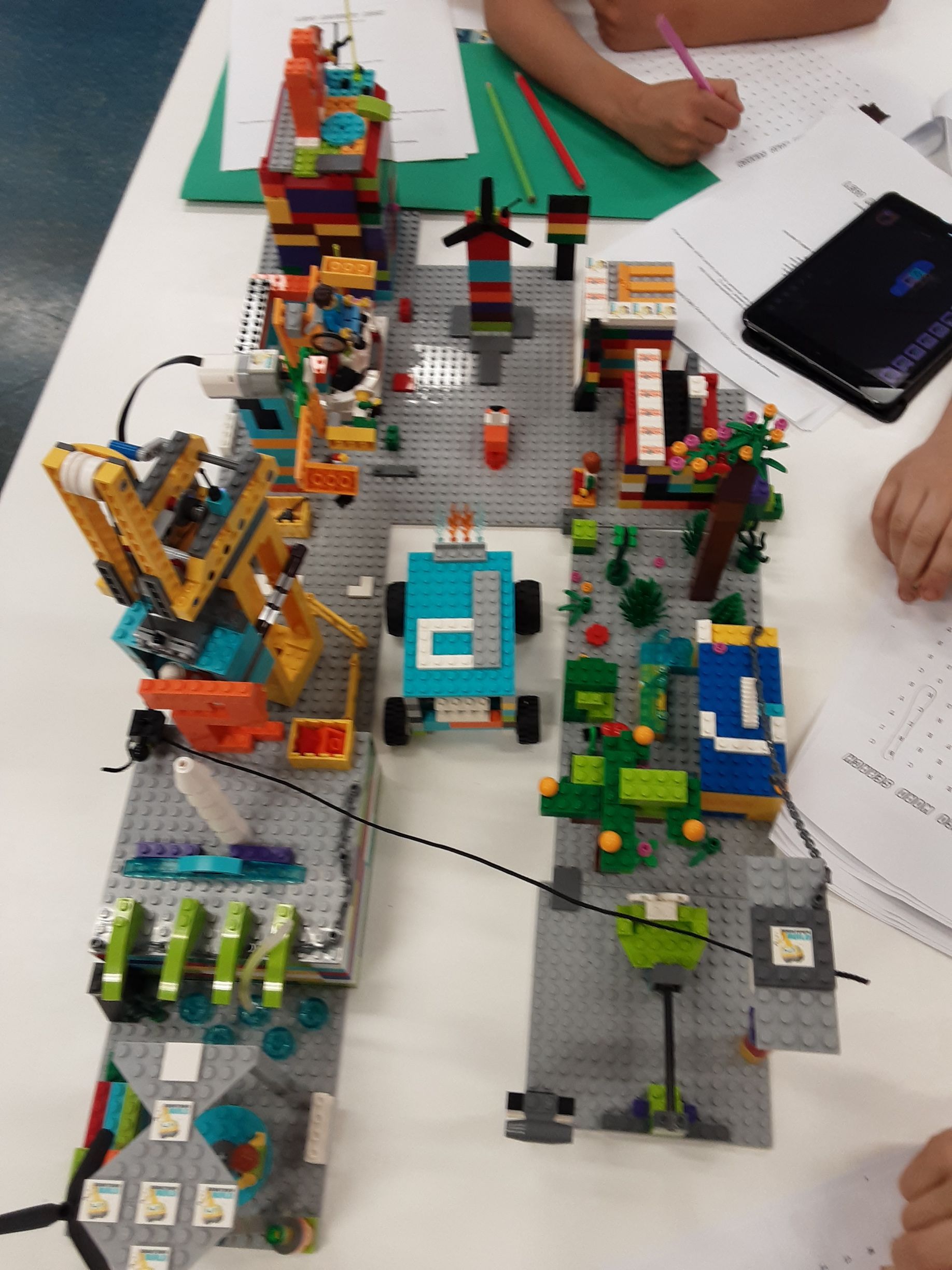 A lego model of a city with the letter p on it