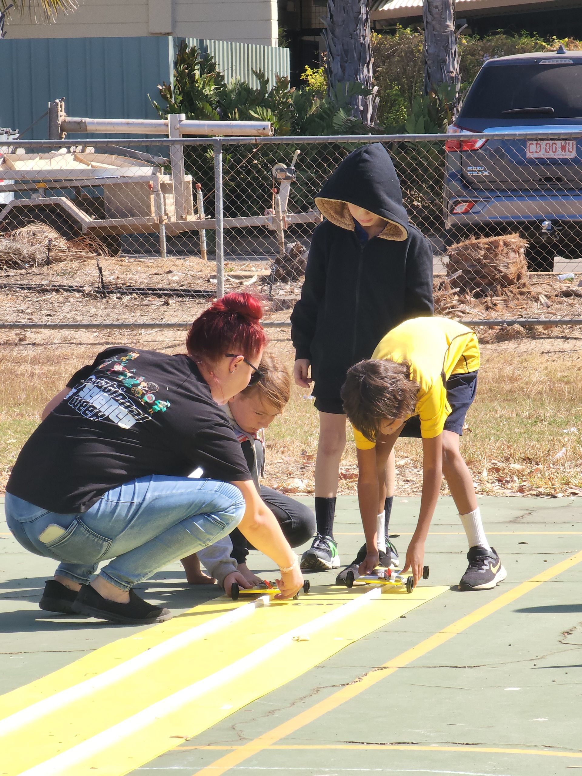 A group of people are working on a track.