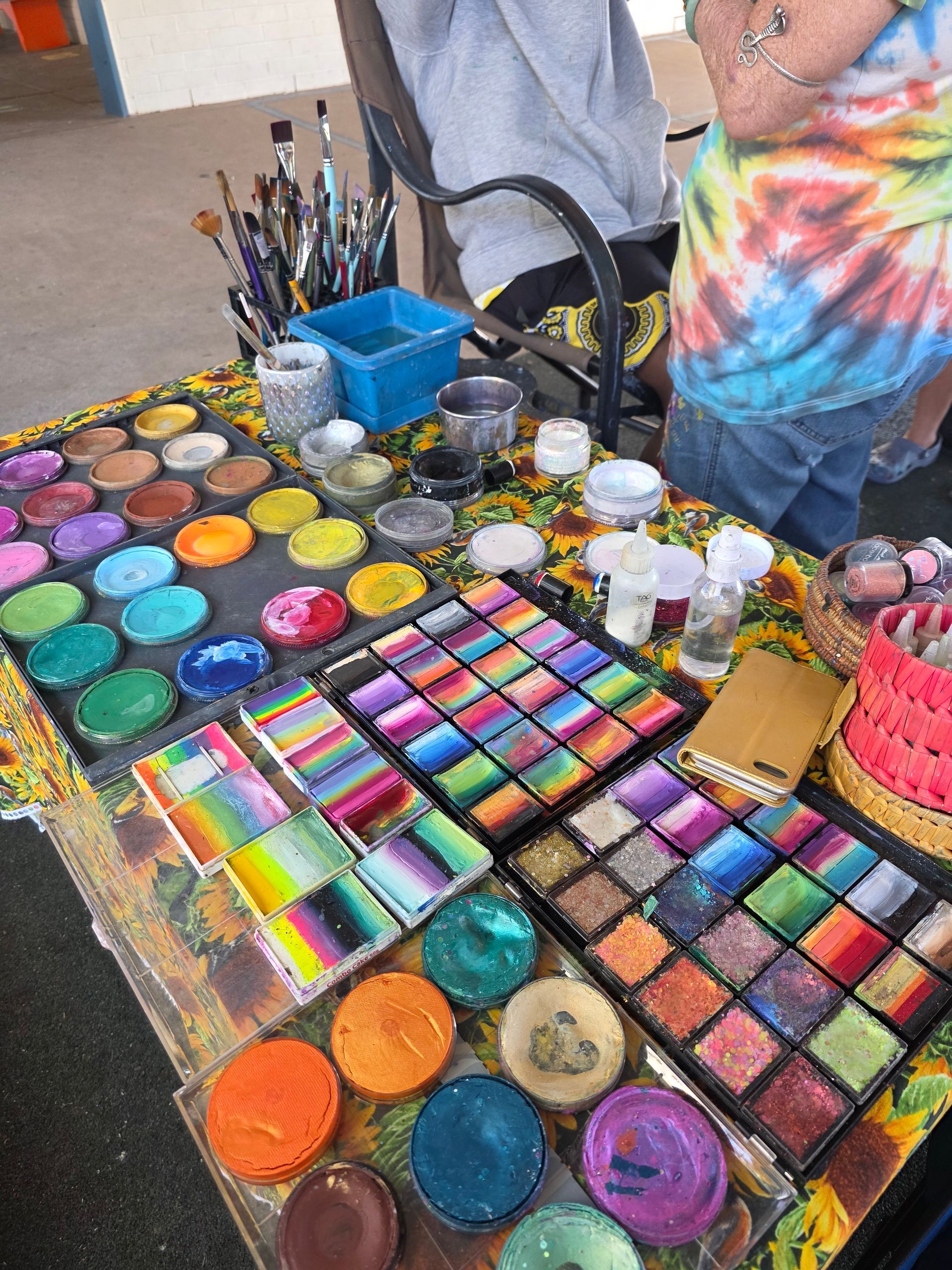 A table with a bunch of makeup on it