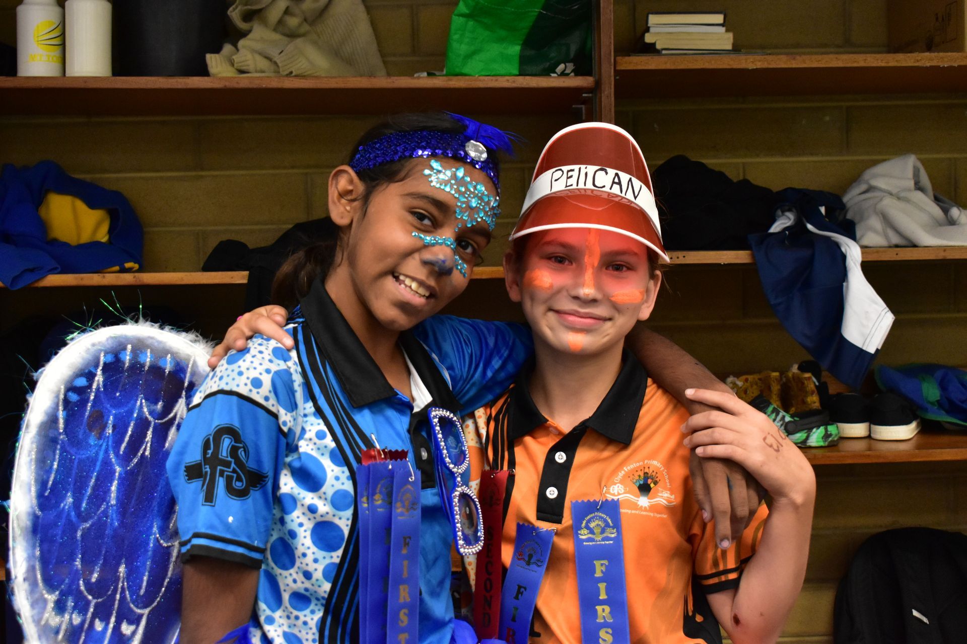 Two young girls are posing for a picture in a locker room.