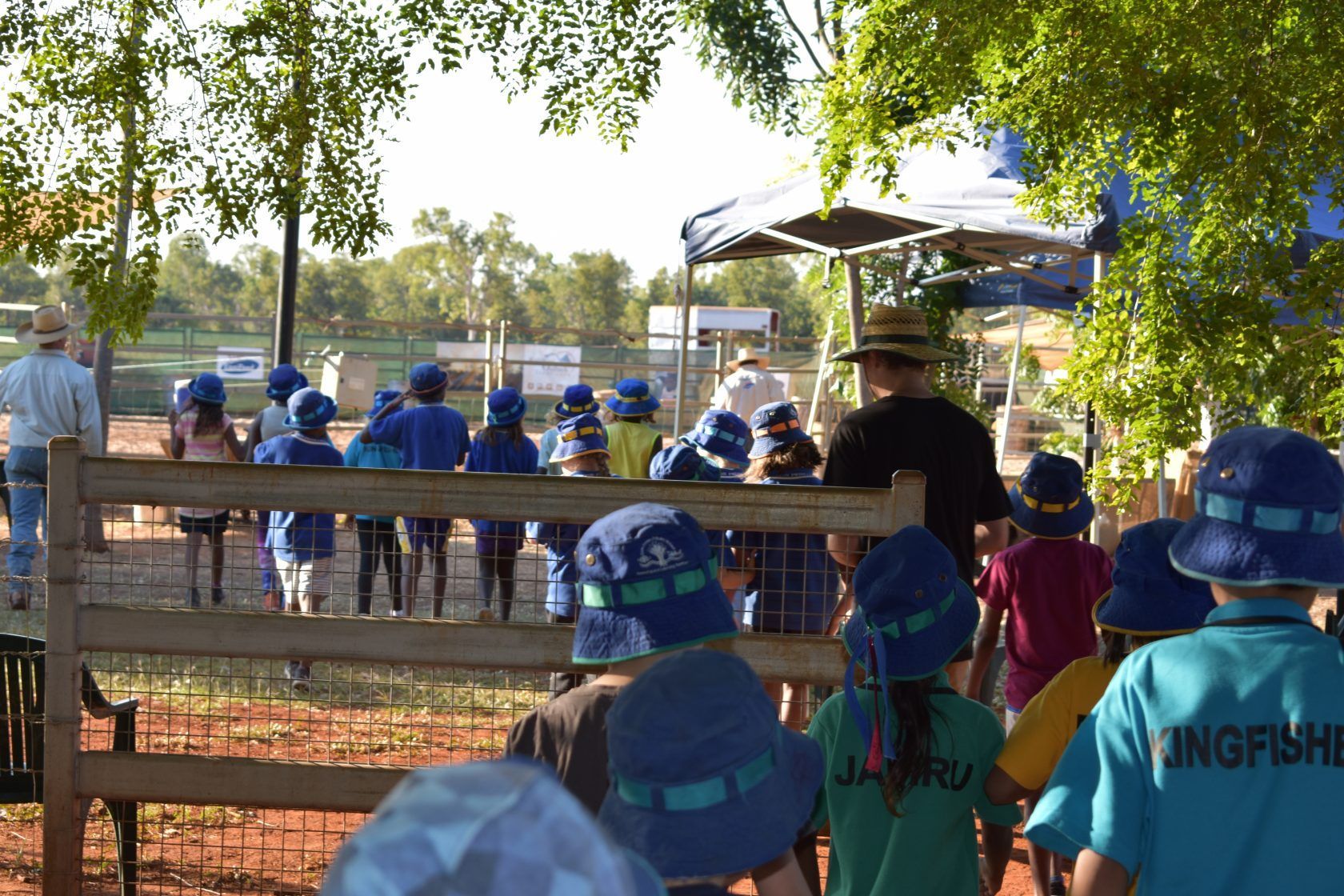 A group of children wearing blue hats and shirts that say kangaroo