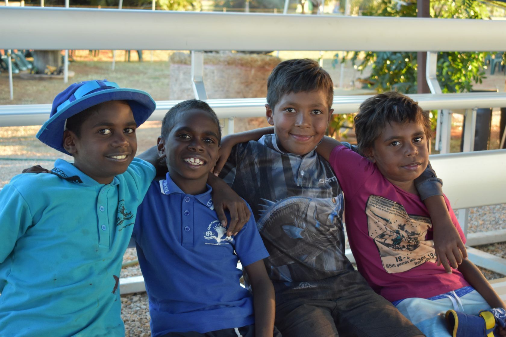 A group of young boys are posing for a picture together.