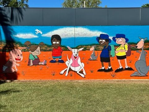 A mural of a group of children and animals on a wall.