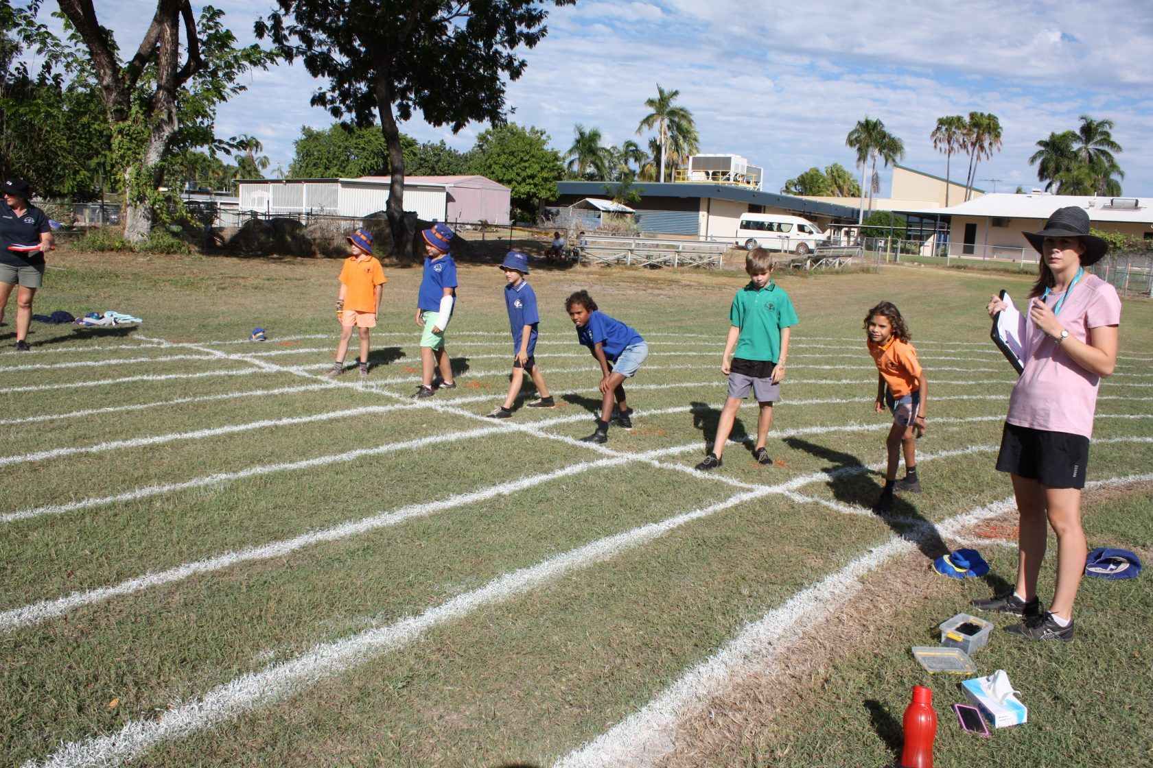 A group of children are running a race on a track