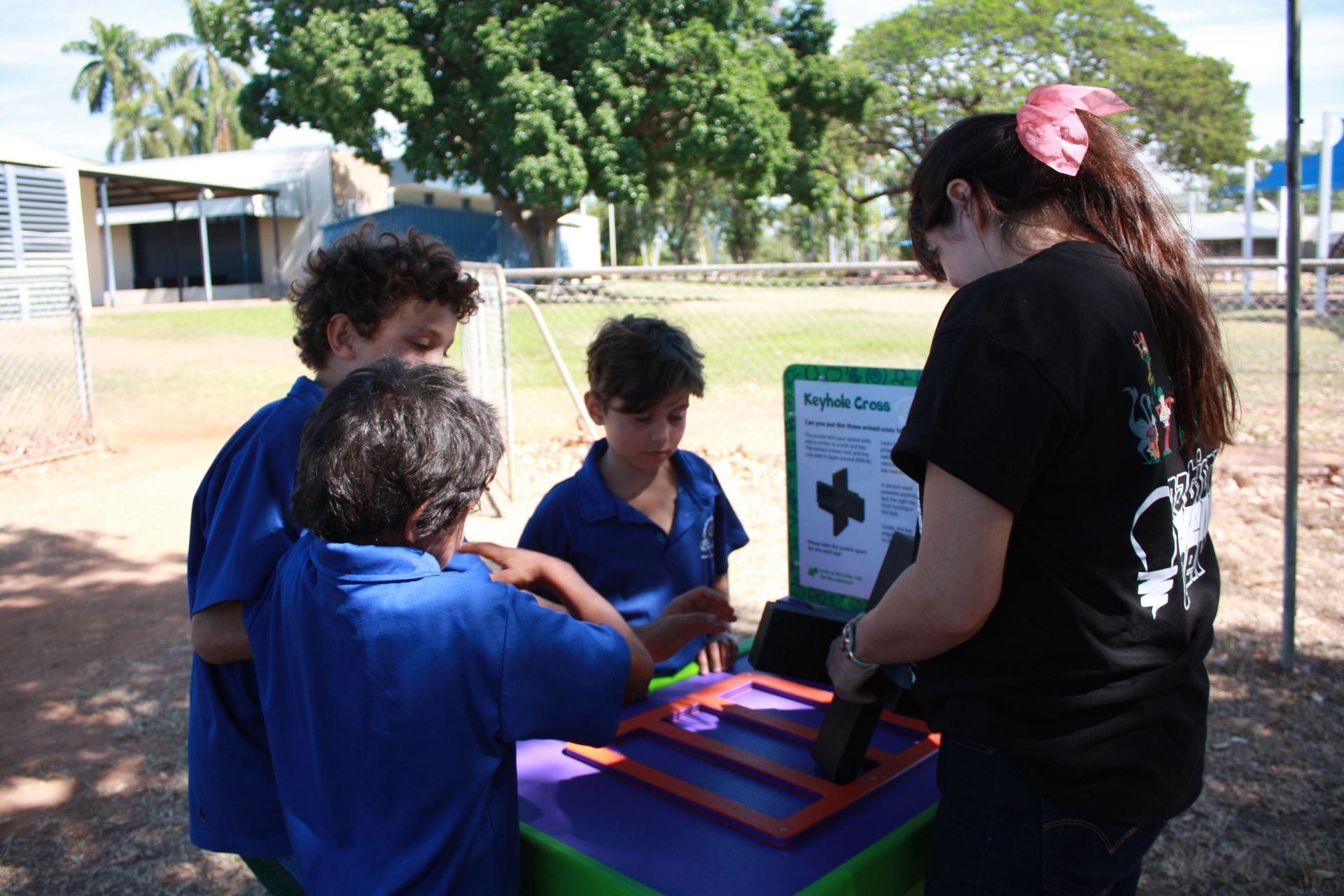 A group of children are playing a game on a table outside