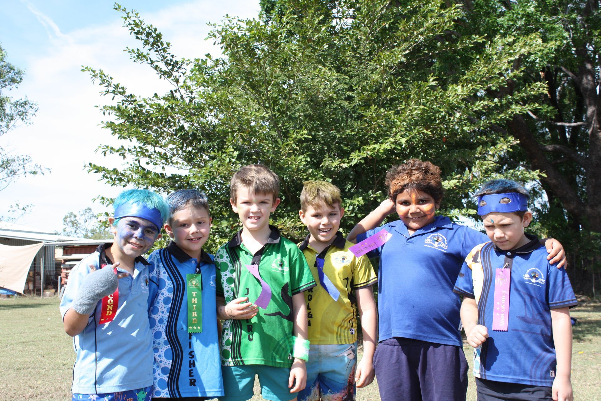 A group of young boys are posing for a picture together