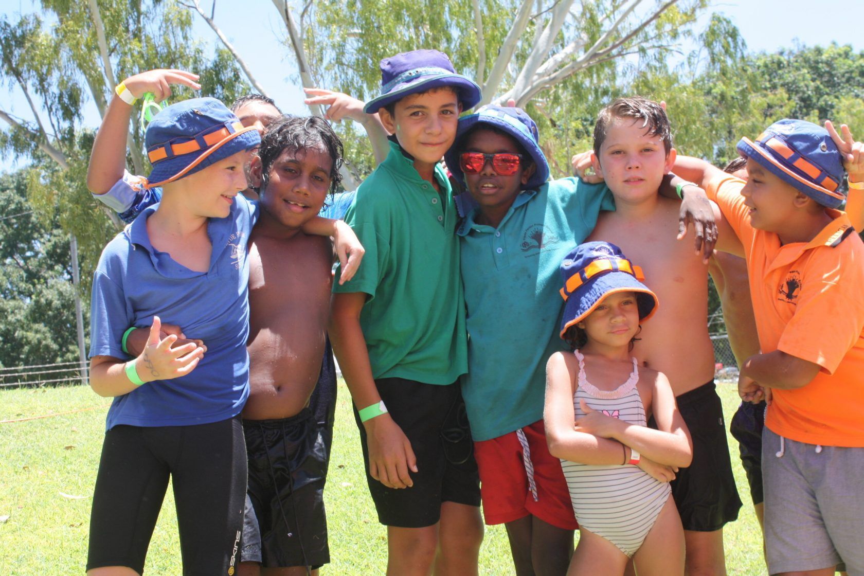A group of young boys and girls posing for a picture