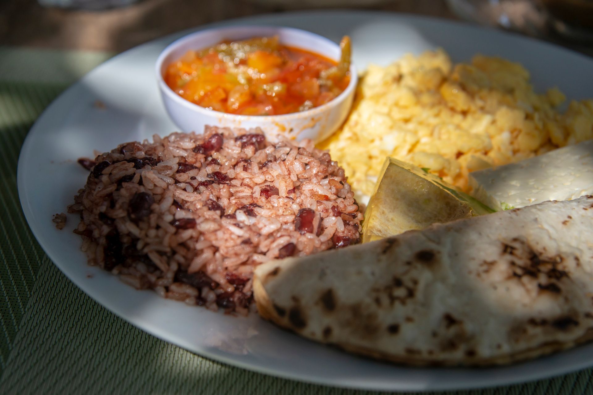 Breakfast plate with rice, beans, scrambled eggs, sauce, and tortillas. Breakfast plate with rice, beans, scrambled eggs, sauce, and tortillas.