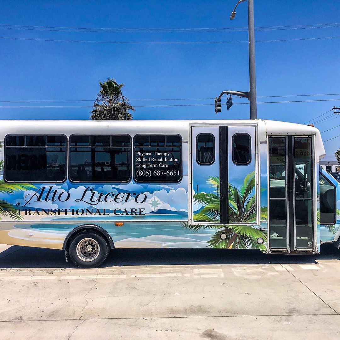 A white bus with the word alto lucero on the side