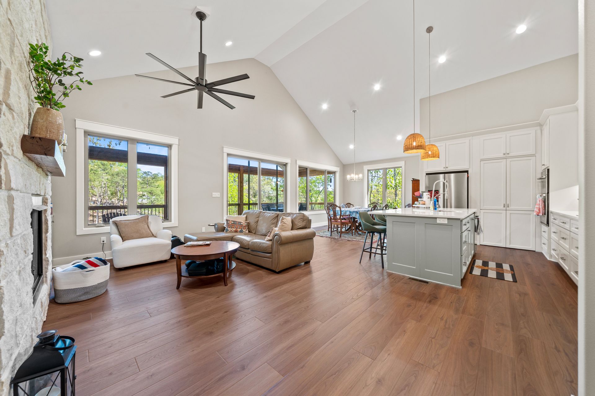 A living room filled with furniture and a ceiling fan.