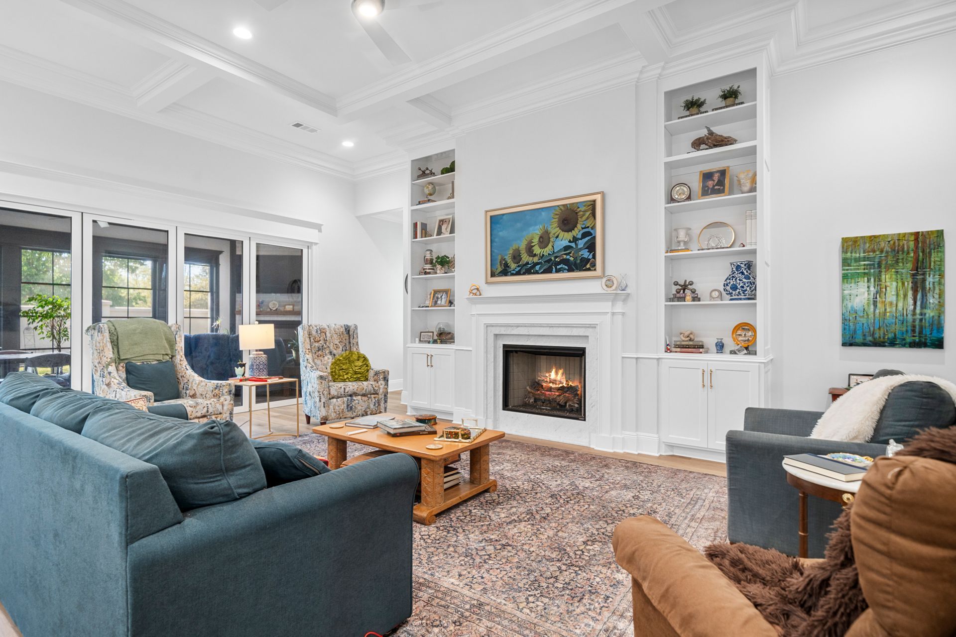 A living room filled with furniture and a fireplace.