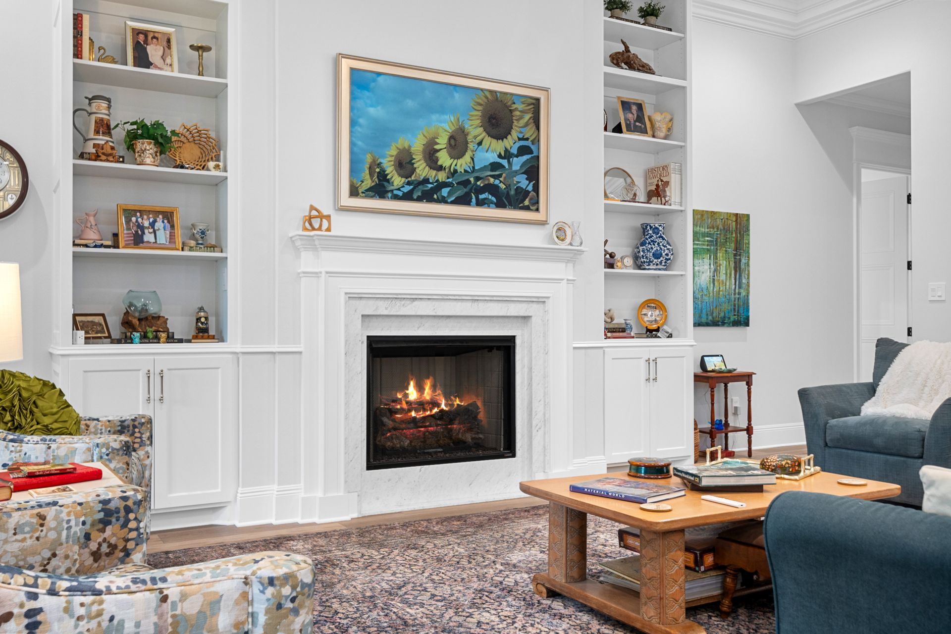 There is a fireplace in the middle of the living room.