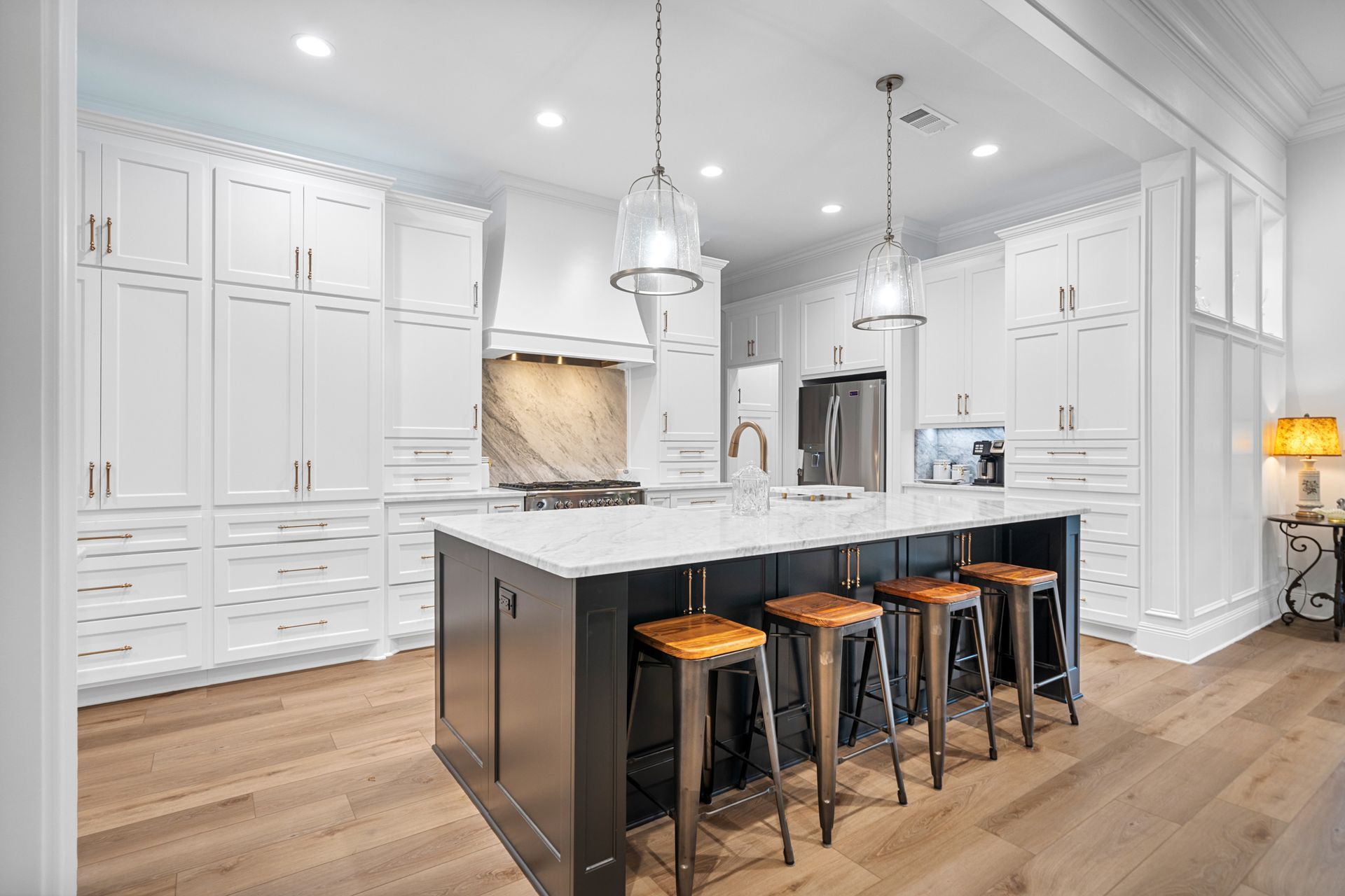 There is a large island in the middle of the kitchen.