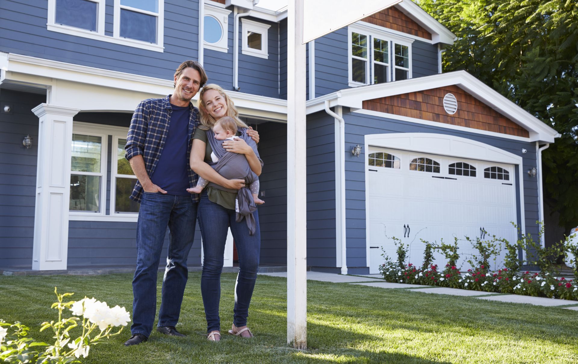 A family in front of their house