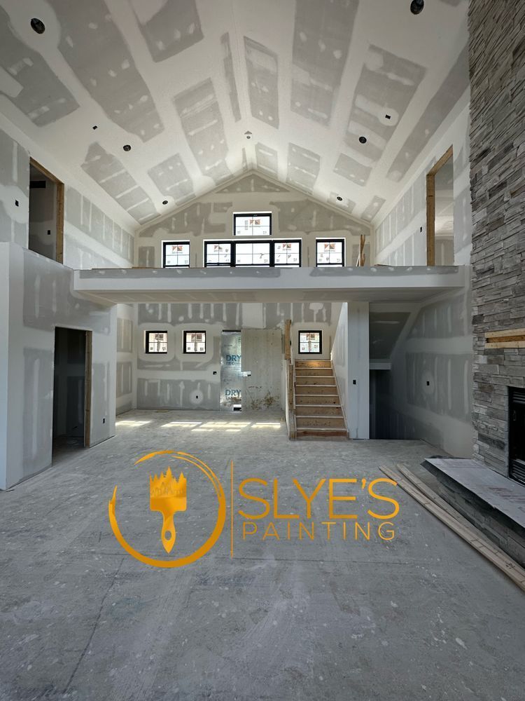 A picture of a house that is being painted by slye 's painting