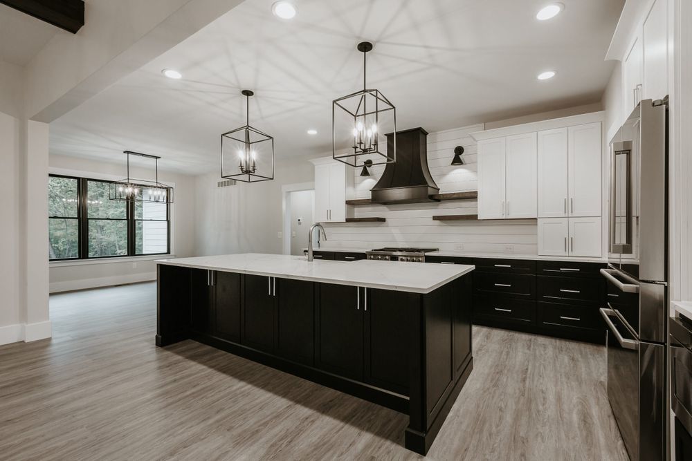 There is a large island in the middle of the kitchen.