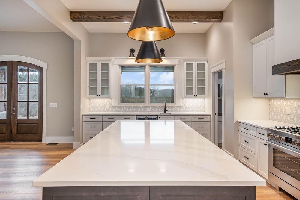 There is a large island in the middle of the kitchen.