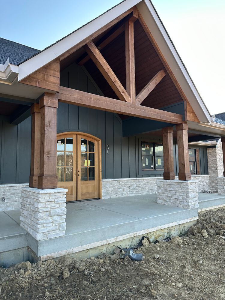 A house with a porch and a wooden roof