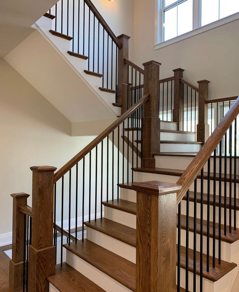 A staircase with wooden steps and a metal railing