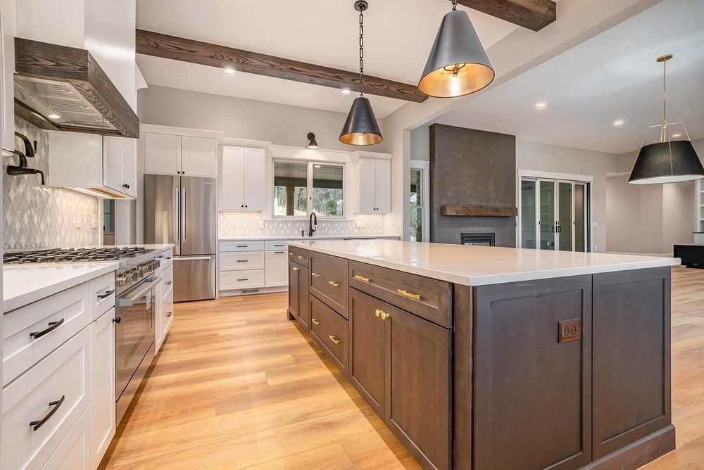 There is a large island in the middle of the kitchen.