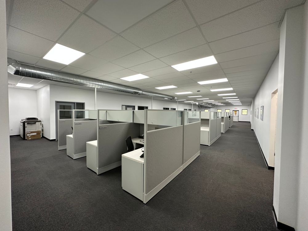 A large office with cubicles and a hallway