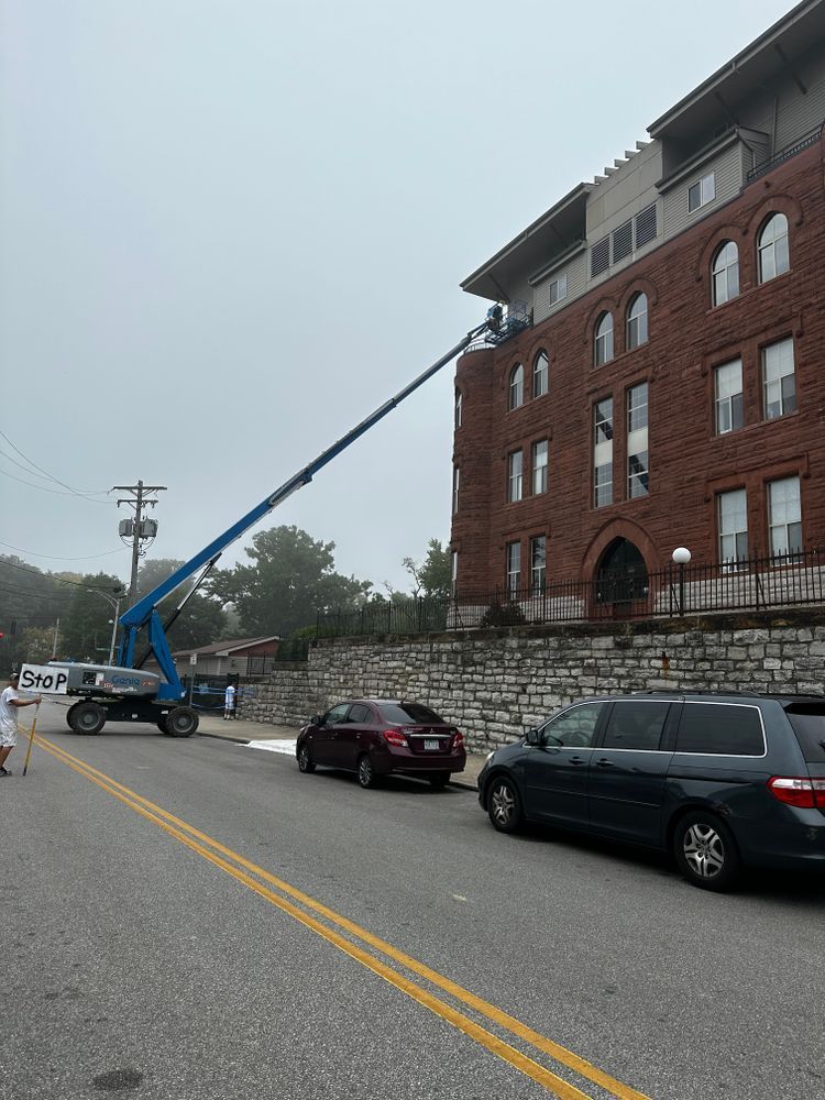 A large brick building with cars parked in front of it
