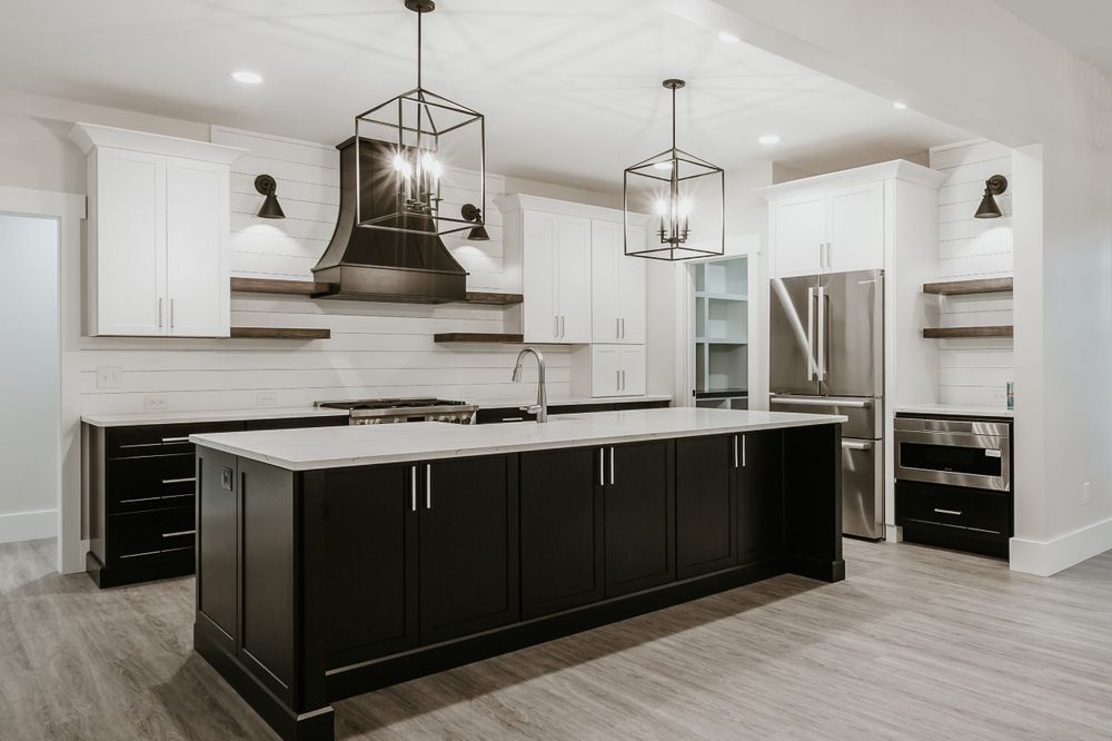 There is a large island in the middle of the kitchen.
