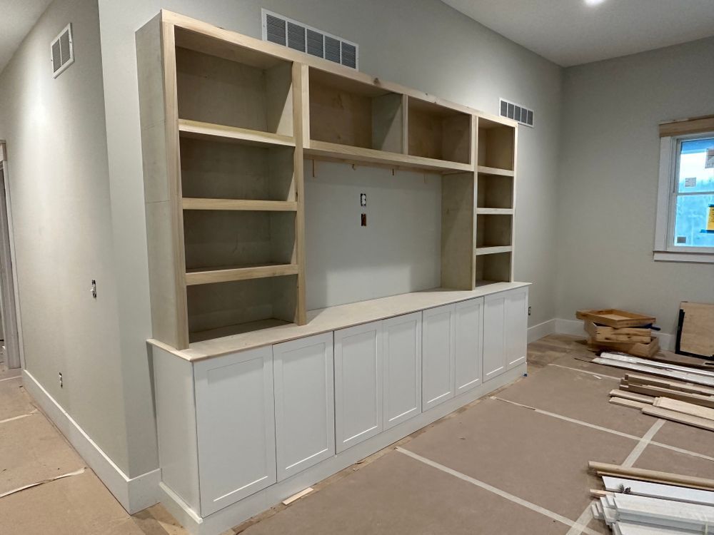 A room with a lot of shelves and cabinets in it.