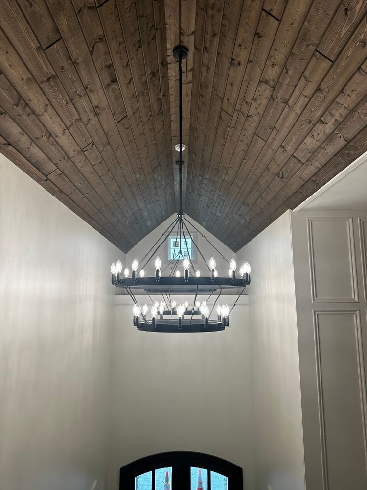 A chandelier is hanging from the ceiling of a room.