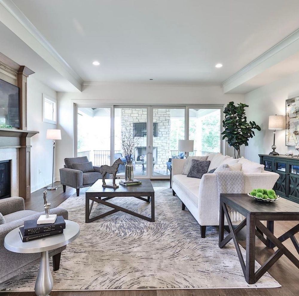 A living room filled with furniture and a fireplace