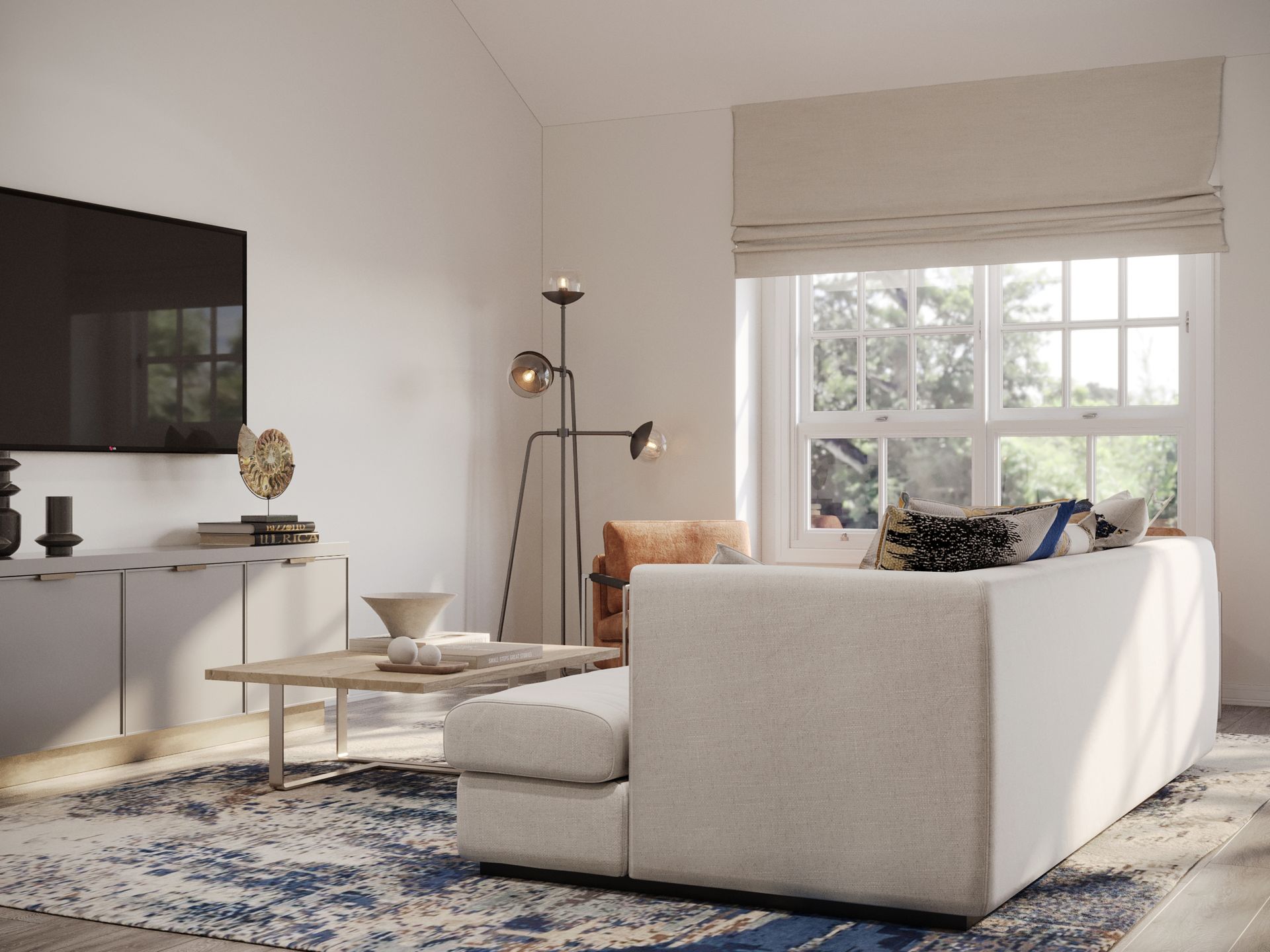 A living room with a couch , coffee table , and television.