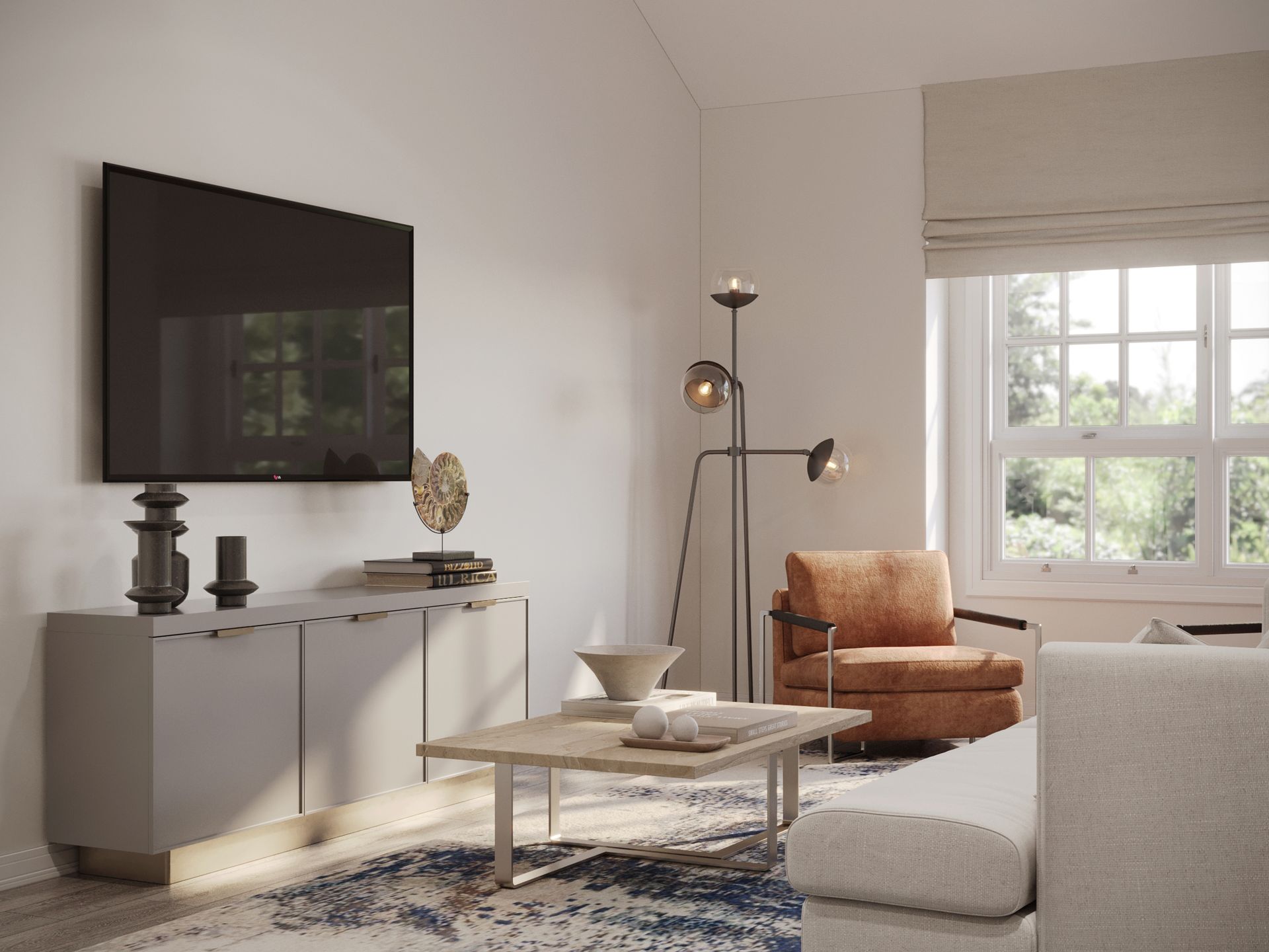 A living room with a couch , chair , coffee table and television.