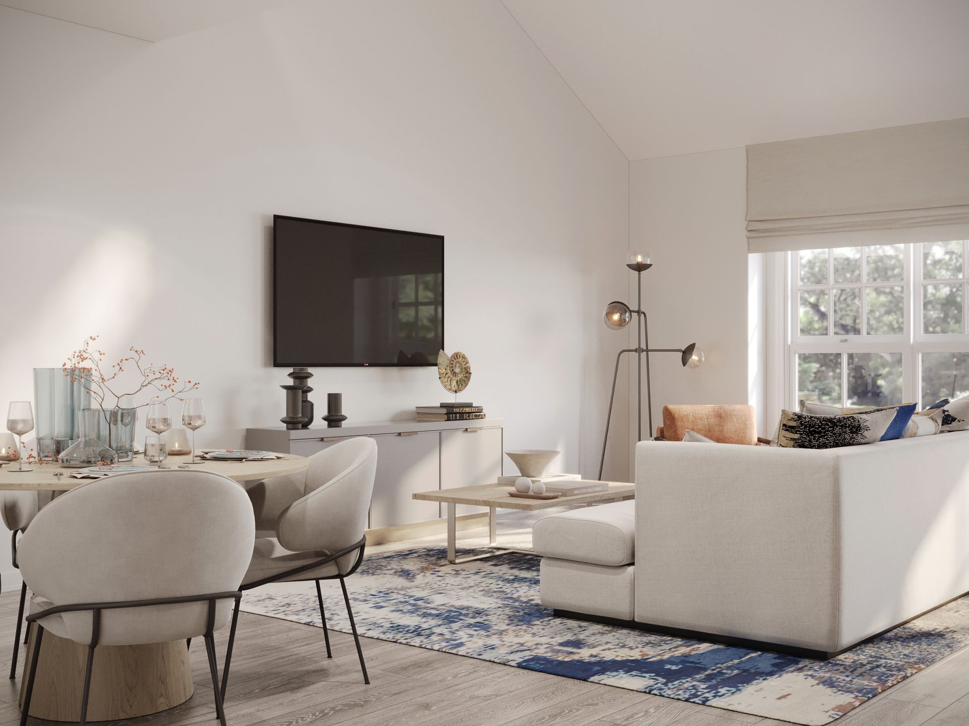 A living room with a couch , chairs , table and television.