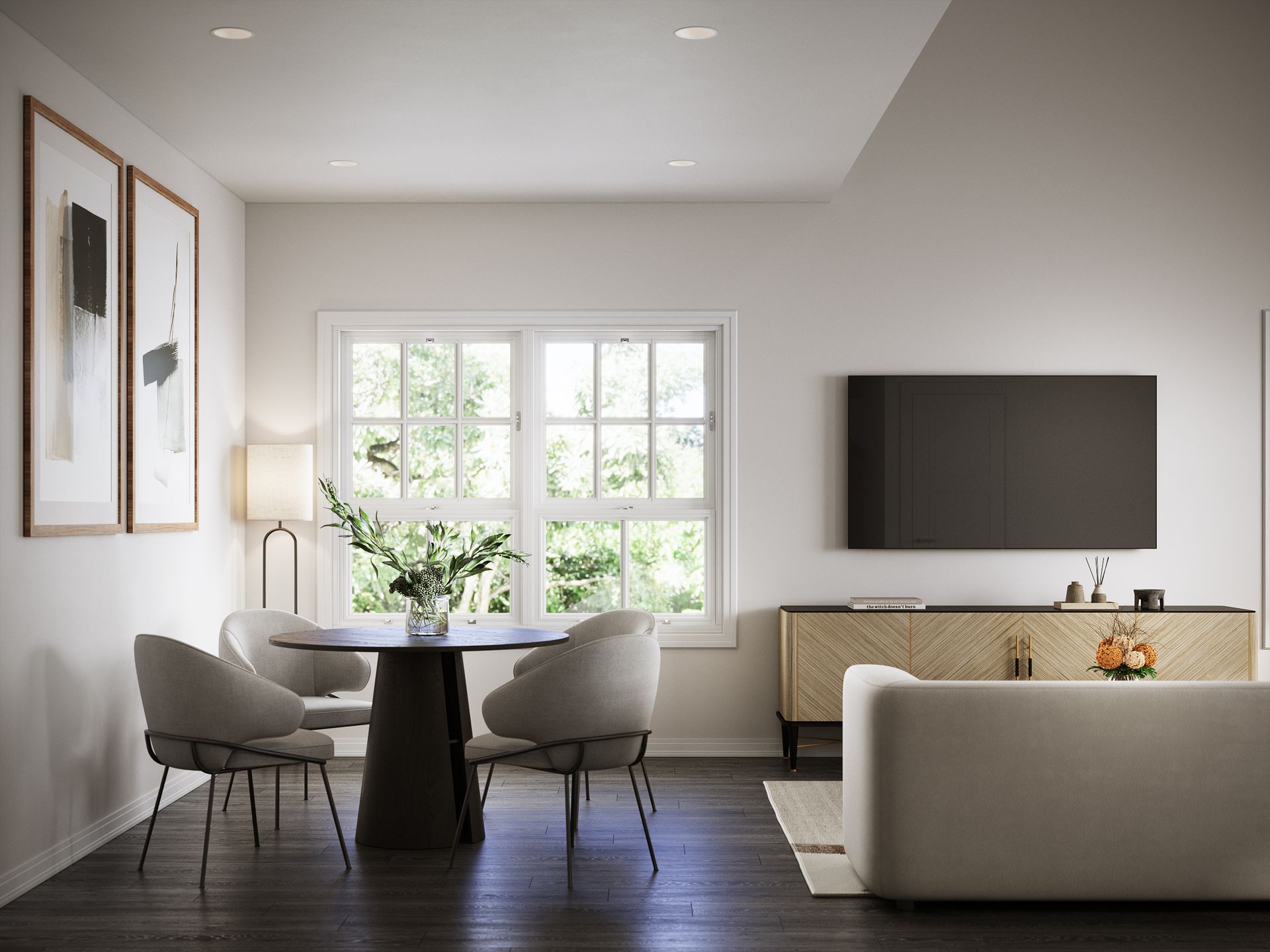 A living room with a couch , table , chairs and a flat screen tv.