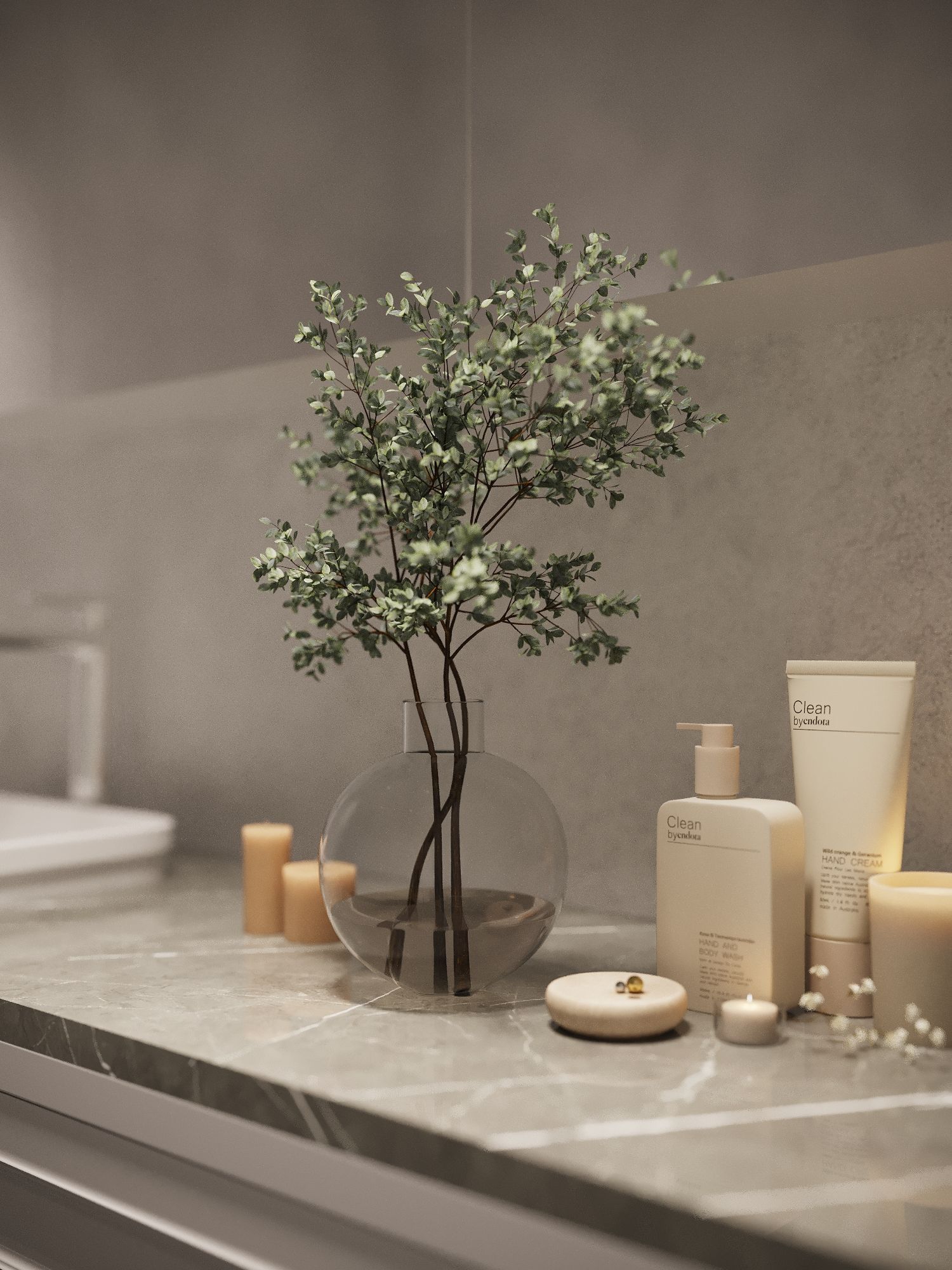A bathroom counter with a vase of flowers and candles.
