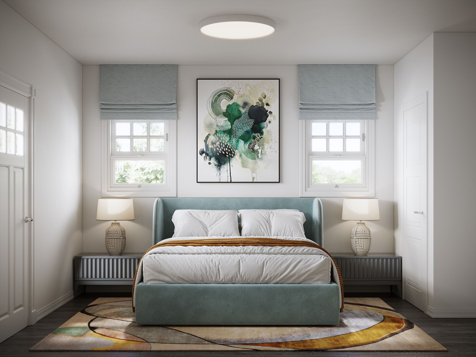 A bedroom with a bed , lamps , a rug and a painting on the wall.