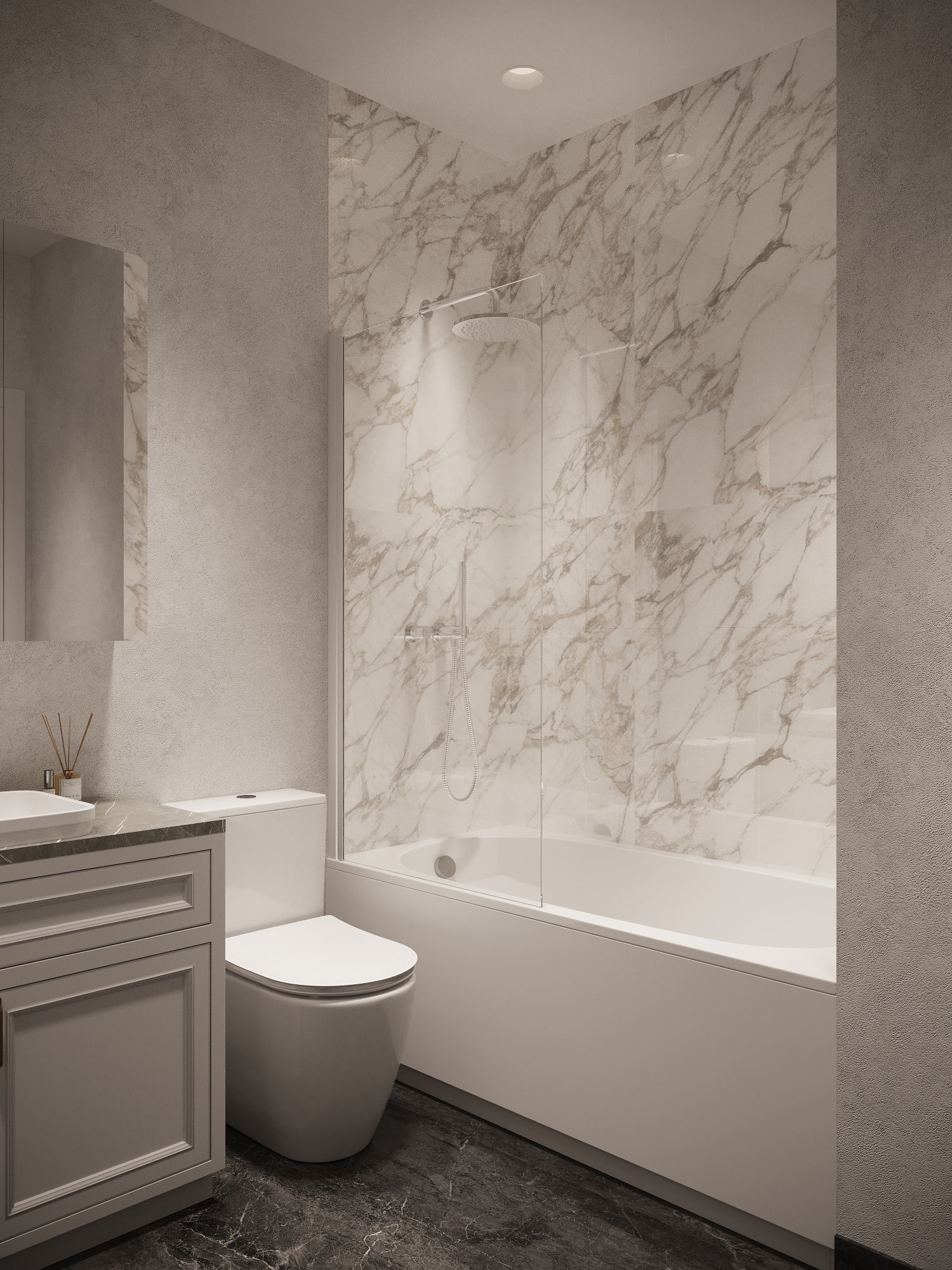 A bathroom with a toilet , sink , bathtub and marble walls.