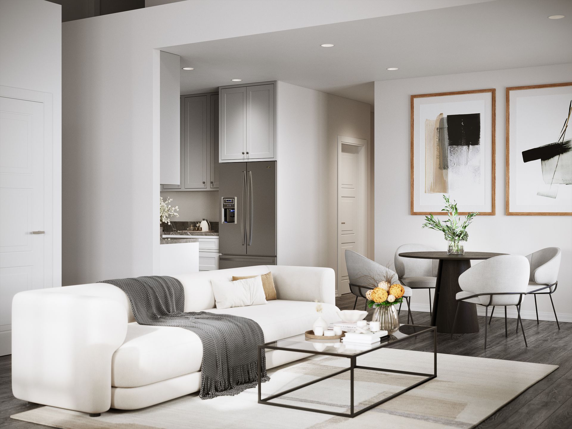 A living room with a white couch , coffee table and chairs.