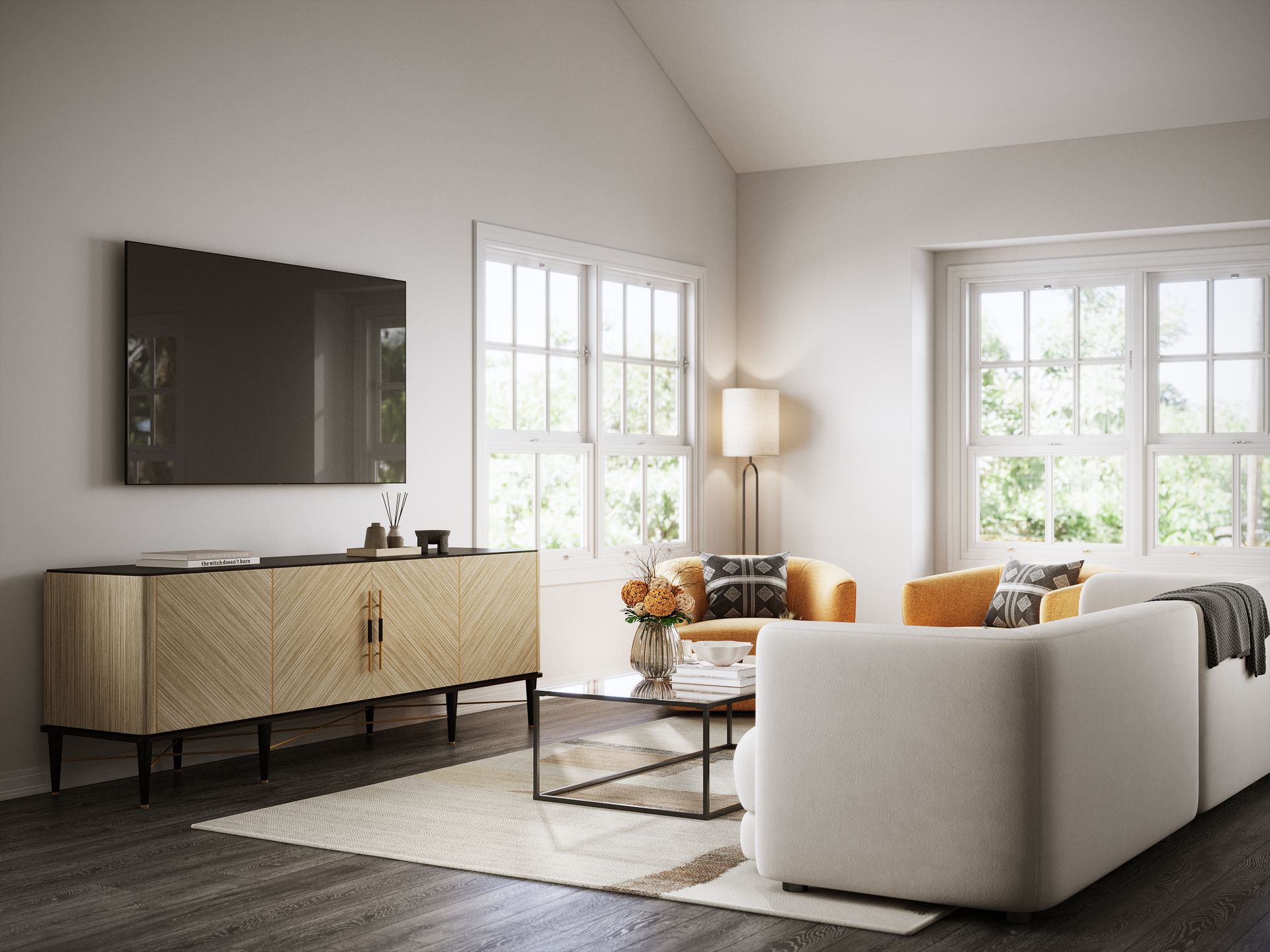 A living room with a couch , chair , coffee table and television.