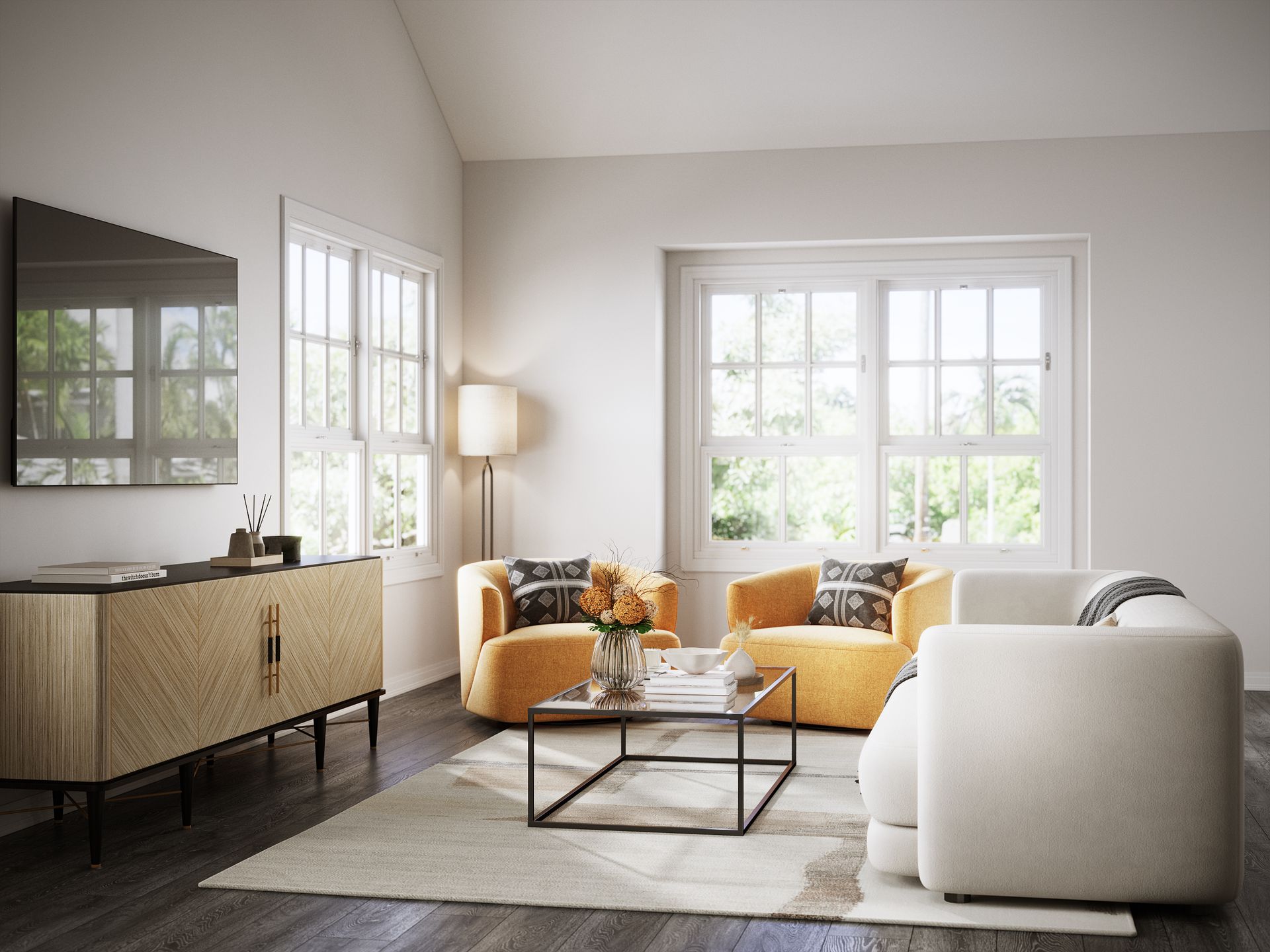 A living room with a couch , two chairs , a coffee table and a flat screen tv.